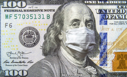 COVID-19 coronavirus in USA, 100 dollar money bill with face mask. Coronavirus affects global stock market.